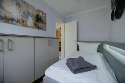 Ein Bett oder Betten in einem Zimmer der Unterkunft Boddenkieker 14