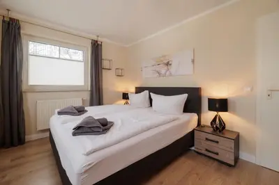 Ein Bett oder Betten in einem Zimmer der Unterkunft Boddenkieker 14