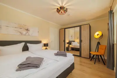 Ein Bett oder Betten in einem Zimmer der Unterkunft Boddenkieker 14