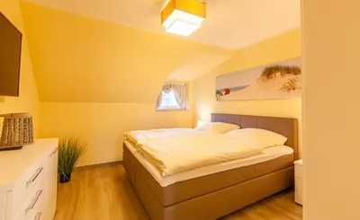 Ein Bett oder Betten in einem Zimmer der Unterkunft Seeadler