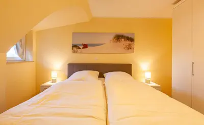Ein Bett oder Betten in einem Zimmer der Unterkunft Seeadler