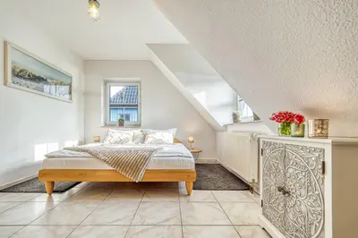 Ein Bett oder Betten in einem Zimmer der Unterkunft Kavelweg 43 OG