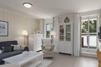 Ein Sitzbereich in der Unterkunft 5-Sterne-Ferienapartment Dünensand direkt am Kurstrand