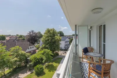 Ein Balkon oder eine Terrasse in der Unterkunft 5-Sterne-Ferienapartment Dünensand direkt am Kurstrand