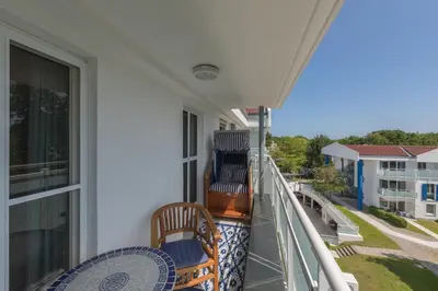 Ein Balkon oder eine Terrasse in der Unterkunft 5-Sterne-Ferienapartment Dünensand direkt am Kurstrand