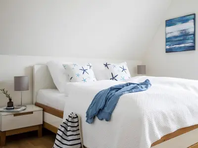 Ein Bett oder Betten in einem Zimmer der Unterkunft Haus am Bodden mit Sauna