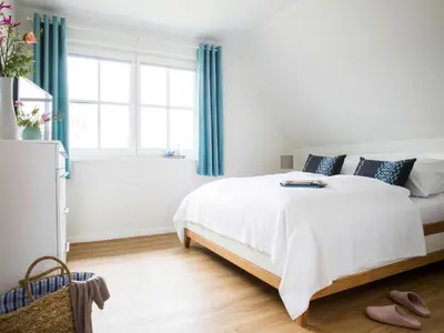 Ein Bett oder Betten in einem Zimmer der Unterkunft Haus am Bodden mit Sauna