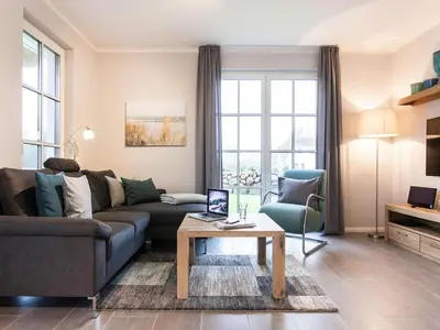 Ein Sitzbereich in der Unterkunft Holiday house, Fuhlendorf