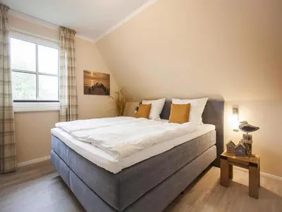Ein Bett oder Betten in einem Zimmer der Unterkunft Komfortables Ferienhaus mit Sauna in Fuhlendorf
