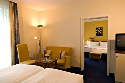 Ein Bett oder Betten in einem Zimmer der Unterkunft Best Western Plus Ostseehotel Waldschloesschen