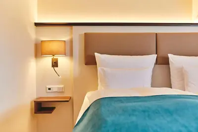 Ein Bett oder Betten in einem Zimmer der Unterkunft Dorint Strandresort & Spa Ostseebad Wustrow