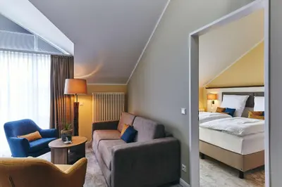 Ein Bett oder Betten in einem Zimmer der Unterkunft Dorint Strandresort & Spa Ostseebad Wustrow