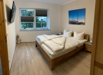 Ein Bett oder Betten in einem Zimmer der Unterkunft Fewo Barth