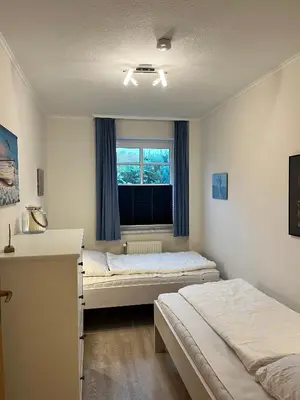 Ein Bett oder Betten in einem Zimmer der Unterkunft Lindenstr. 20 EG-Re Wg.4