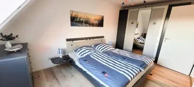 Ein Bett oder Betten in einem Zimmer der Unterkunft Lindenstr.32 Whg 4
