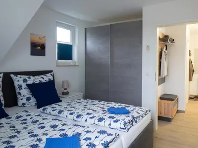 Ein Bett oder Betten in einem Zimmer der Unterkunft Lachmöwe 03