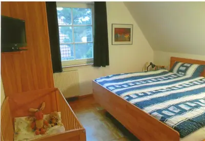 Ein Bett oder Betten in einem Zimmer der Unterkunft Lindenstr.32b