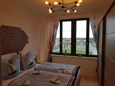 Ein Bett oder Betten in einem Zimmer der Unterkunft Sunshine Speicherresidenz Barth