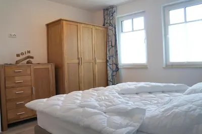 Ein Bett oder Betten in einem Zimmer der Unterkunft Lindenstrasse 13 Wohnung 4