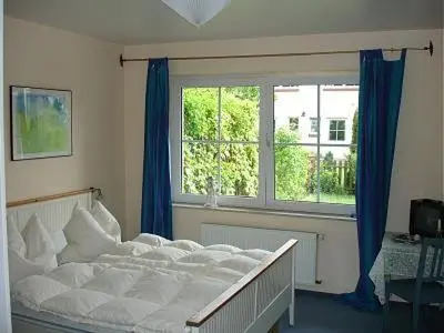 Ein Bett oder Betten in einem Zimmer der Unterkunft Martha-Müller-Grählert-Weg 3 Wg.2