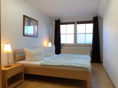 Ein Bett oder Betten in einem Zimmer der Unterkunft Martha-Müller-Grählert-Weg 8 Wg.7