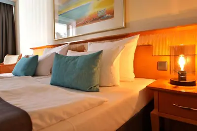 Ein Bett oder Betten in einem Zimmer der Unterkunft Hotel Bernstein Prerow