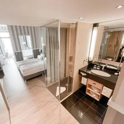Ein Bett oder Betten in einem Zimmer der Unterkunft Resort Hotel IV Jahreszeiten Zingst