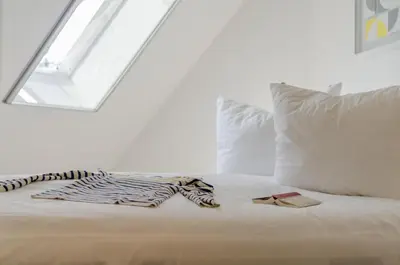 Ein Bett oder Betten in einem Zimmer der Unterkunft Müggenburger Weg Wohnung 2/5