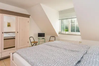 Ein Bett oder Betten in einem Zimmer der Unterkunft Neue Reihe