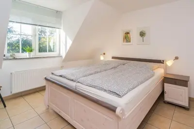 Ein Bett oder Betten in einem Zimmer der Unterkunft Neue Reihe