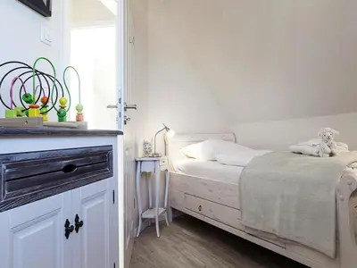 Ein Bett oder Betten in einem Zimmer der Unterkunft Luxushaus Boddenküste mit Sauna