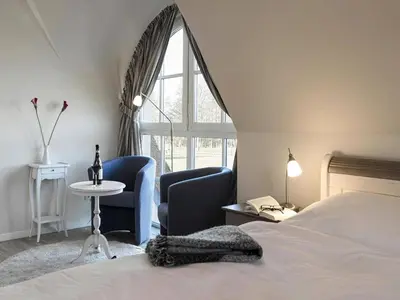 Ein Bett oder Betten in einem Zimmer der Unterkunft Luxushaus Boddenküste mit Sauna