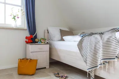 Ein Bett oder Betten in einem Zimmer der Unterkunft Luxushaus am Bodden mit Sauna