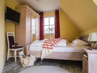 Ein Bett oder Betten in einem Zimmer der Unterkunft Luxushaus Bodstedt mit Sauna am Bodden