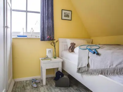 Ein Bett oder Betten in einem Zimmer der Unterkunft Luxushaus Bodstedt mit Sauna am Bodden