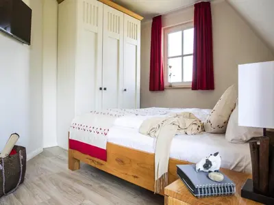 Ein Bett oder Betten in einem Zimmer der Unterkunft Luxushaus Boddenküste mit Sauna