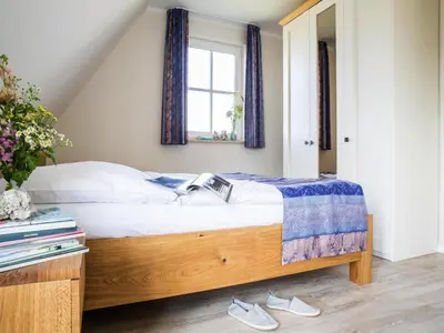 Ein Bett oder Betten in einem Zimmer der Unterkunft Luxushaus Boddenküste mit Sauna