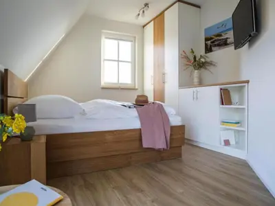 Ein Bett oder Betten in einem Zimmer der Unterkunft Luxushaus Bodden mit Sauna