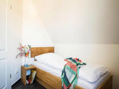 Ein Bett oder Betten in einem Zimmer der Unterkunft Luxushaus Boddenküste mit Sauna