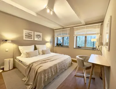 Ein Bett oder Betten in einem Zimmer der Unterkunft Dünenhof DÜNENHOF Whg. D-01