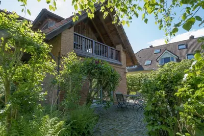 Ein Garten an der Unterkunft Dünenhof DÜNENHOF Whg. D-01