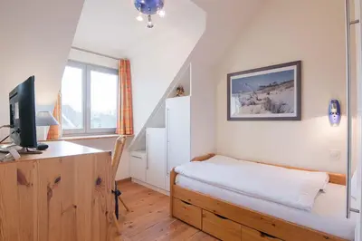 Ein Bett oder Betten in einem Zimmer der Unterkunft Dünenhof DÜNENHOF Whg. D-04