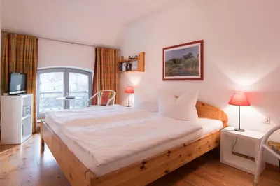 Ein Bett oder Betten in einem Zimmer der Unterkunft Dünenhof DÜNENHOF Whg. D-04