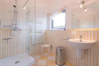 Ein Badezimmer in der Unterkunft Dünenhof DÜNENHOF Whg. D-04
