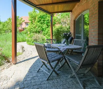Ein Garten an der Unterkunft Dünenhof DÜNENHOF Whg. D-05