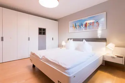 Ein Bett oder Betten in einem Zimmer der Unterkunft Dünenhof DÜNENHOF Whg. D-05