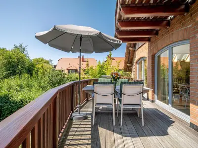 Ein Balkon oder eine Terrasse in der Unterkunft Dünenhof DÜNENHOF Whg. D-07