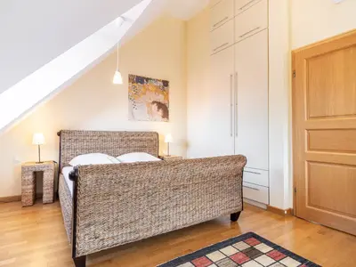 Ein Bett oder Betten in einem Zimmer der Unterkunft Dünenhof DÜNENHOF Whg. D-07