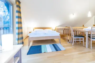 Ein Bett oder Betten in einem Zimmer der Unterkunft Dünenhof DÜNENHOF Whg. D-10