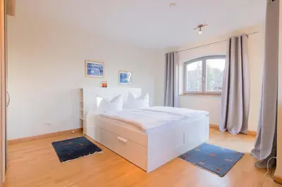 Ein Bett oder Betten in einem Zimmer der Unterkunft Dünenhof DÜNENHOF Whg. D-12